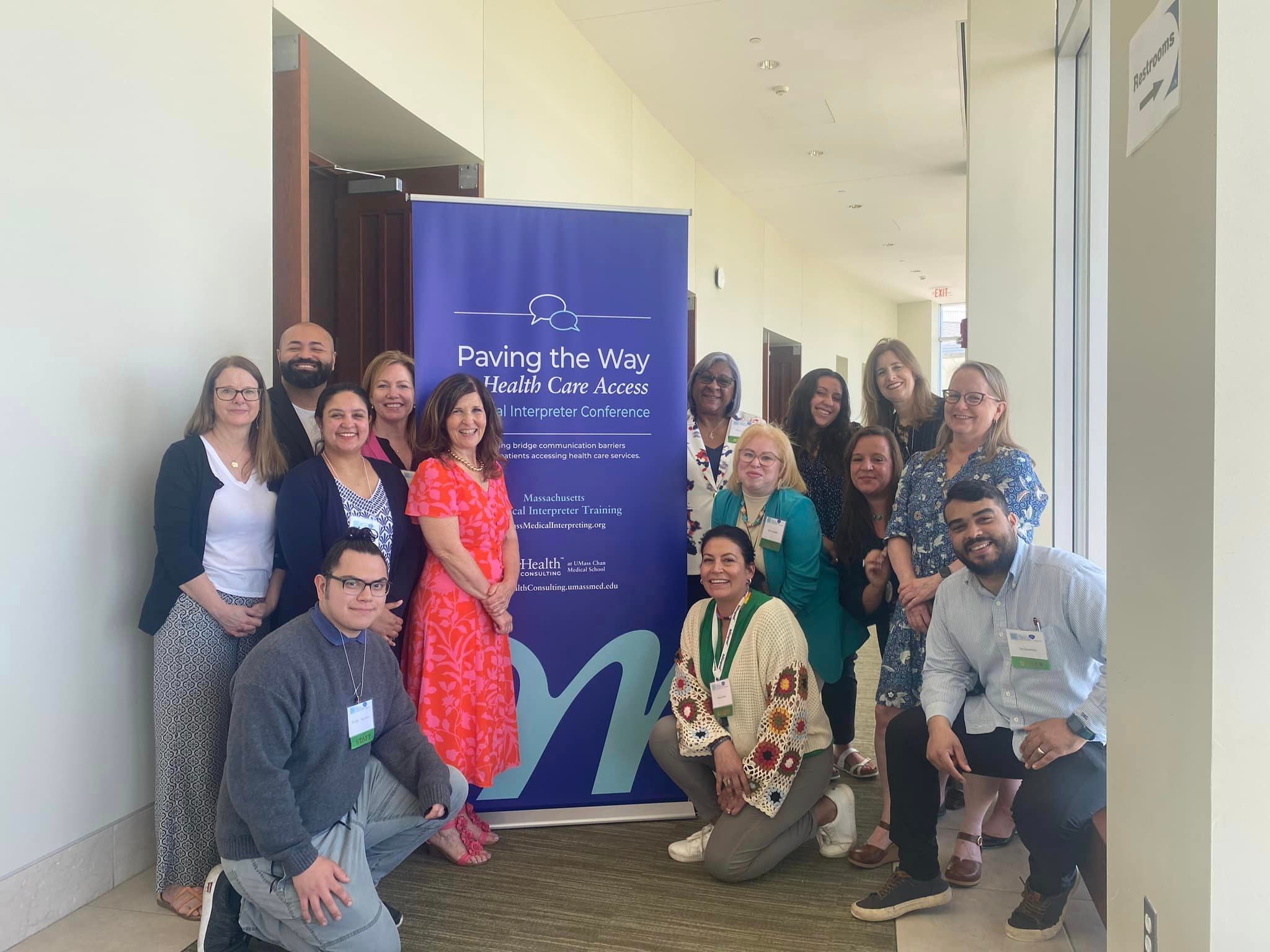 The Paving the Way to Health Care Access Conference team gathers together.